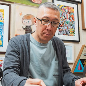 A portrait of artist Kasing Lung, the creator of Zimomo and Labubu.